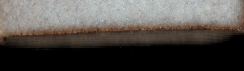 Blurry edge of a test tile on scan, which I assume is due to the lacking depth of field of the flatbed scanner.