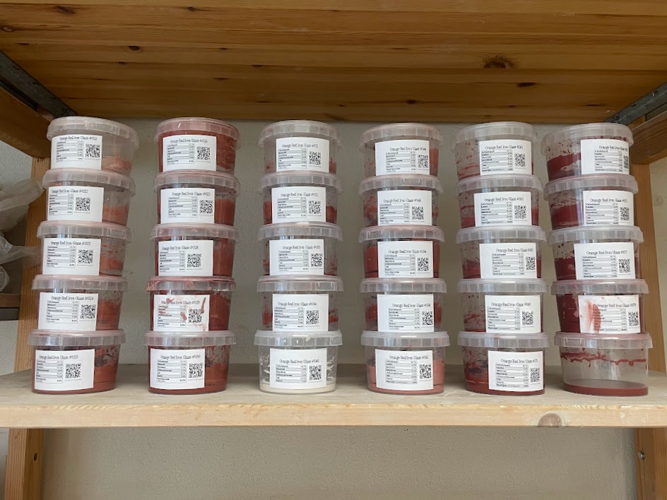 Dozens of numbered glaze batches, each stored in their own labelled tub.