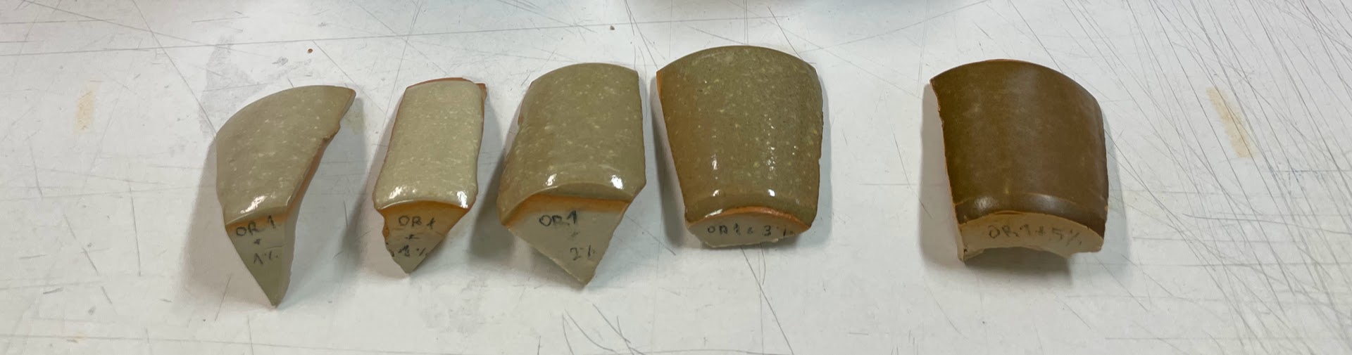 Tests from a cut up cylinder with the OR1 base recipe at 1240°C, with 1 to 5% red iron oxide.