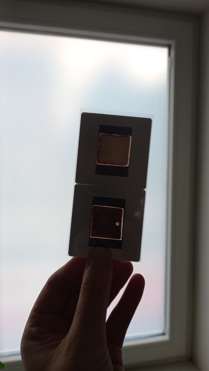 Tile scans mounted as 35mm slides, held up to the light.