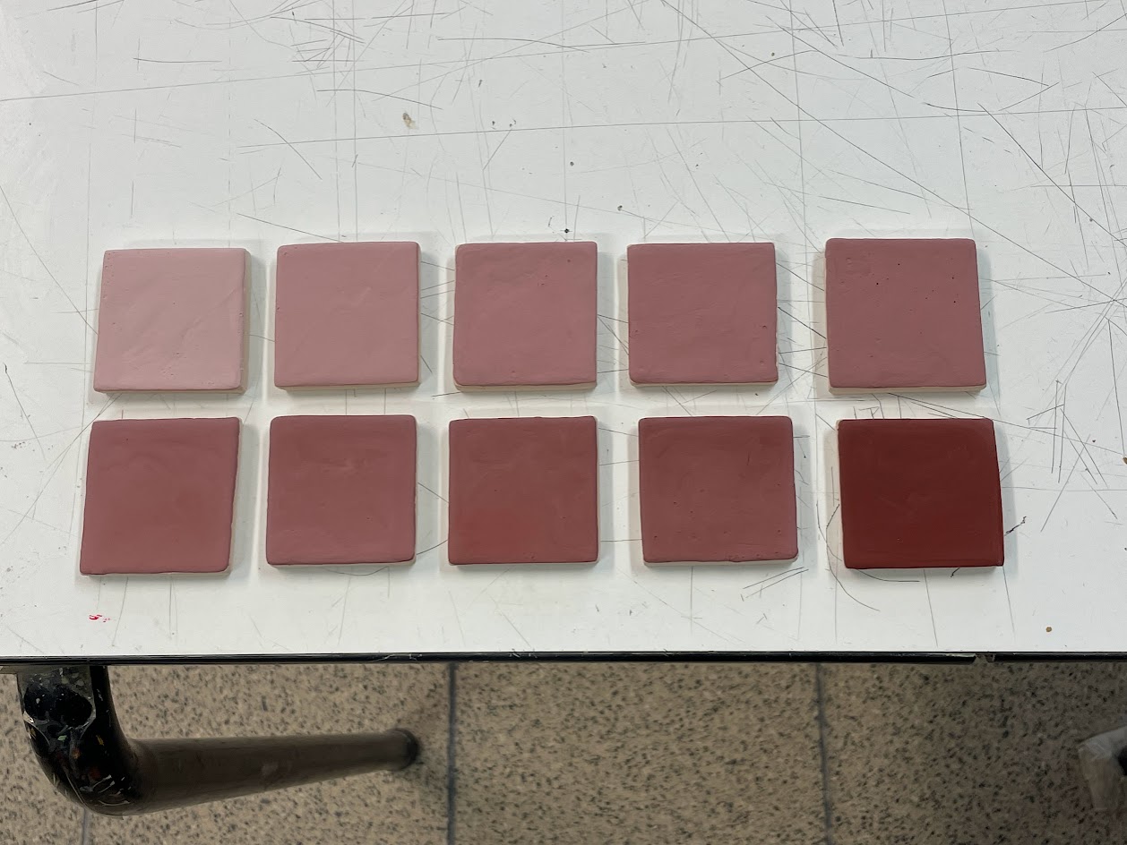 Glazed test tiles before firing.